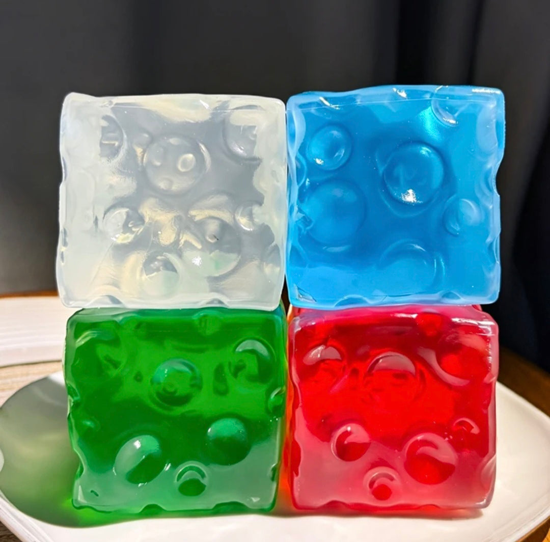 Vaseline Cheese Squishy i fire farger – klar, blå, grønn, rød