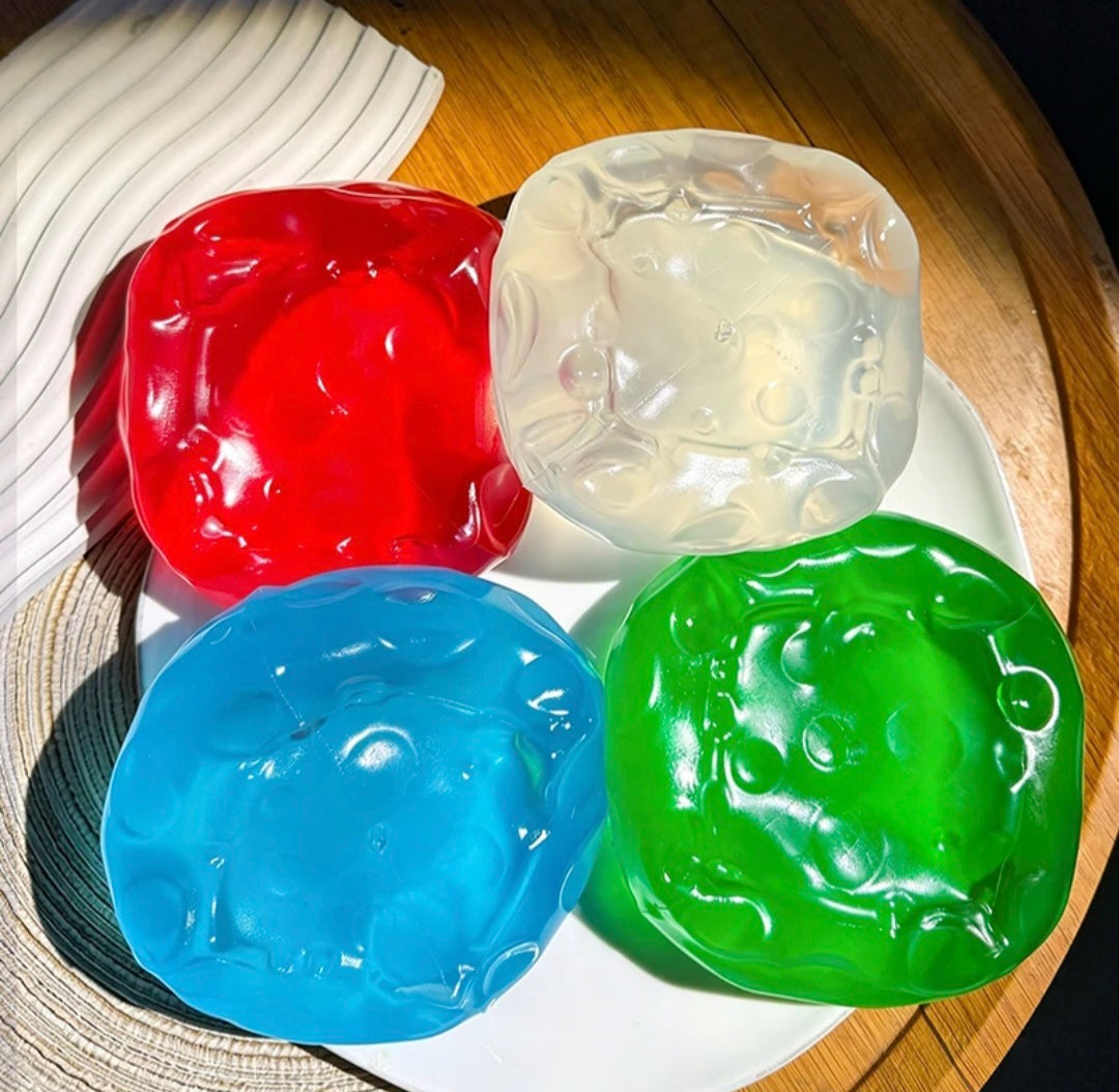 Vaseline Cheese Squishy ovenfra – klar, blå, grønn, rød